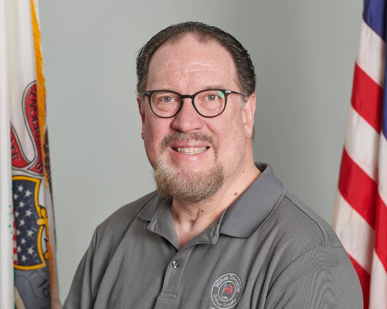 Drew Ellis Bio Photo in front of flag